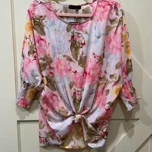 Nwt Boutique brand, Wild sweet Pea. Floral top with elastic cuffs.